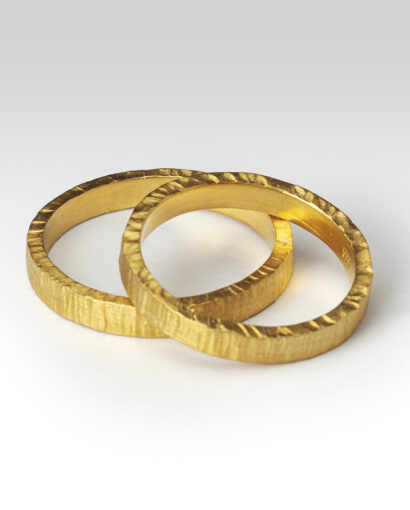 Wedding bands in hammered gold Contemporary Bands