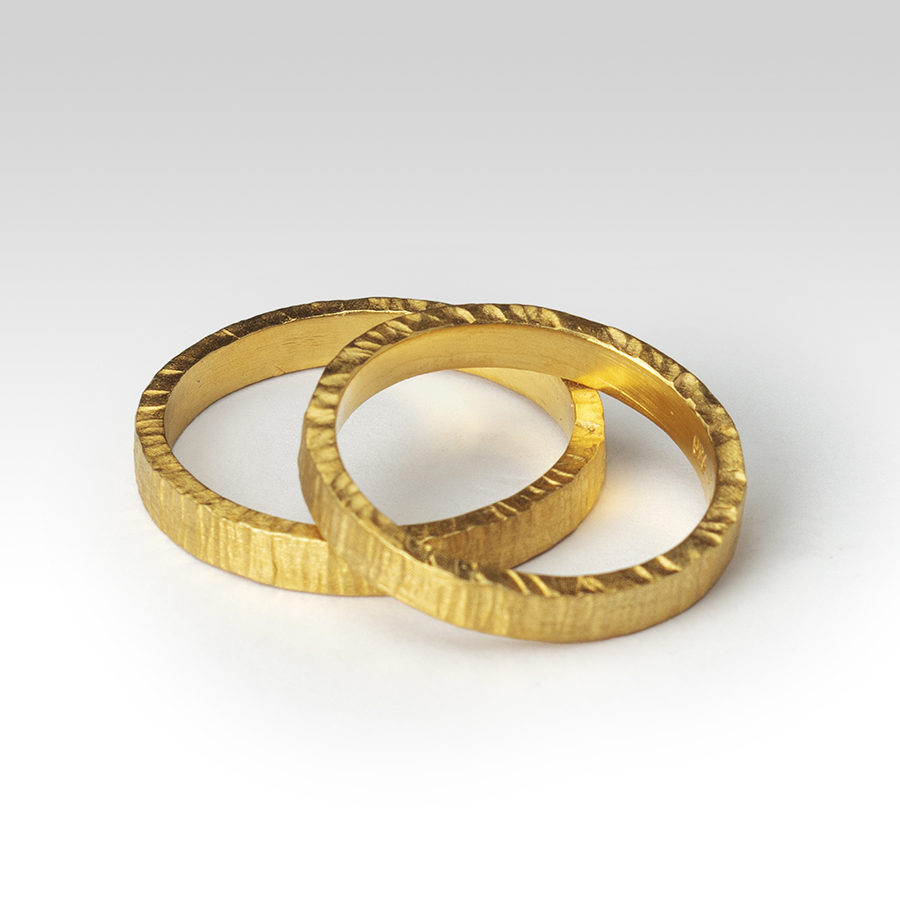 Wedding bands in hammered gold Contemporary Bands